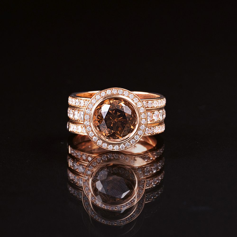 Galeries du Diamant, Paris - An Entourage Ring with Fancy Diamond An Entourage Ring with Fancy Diamond