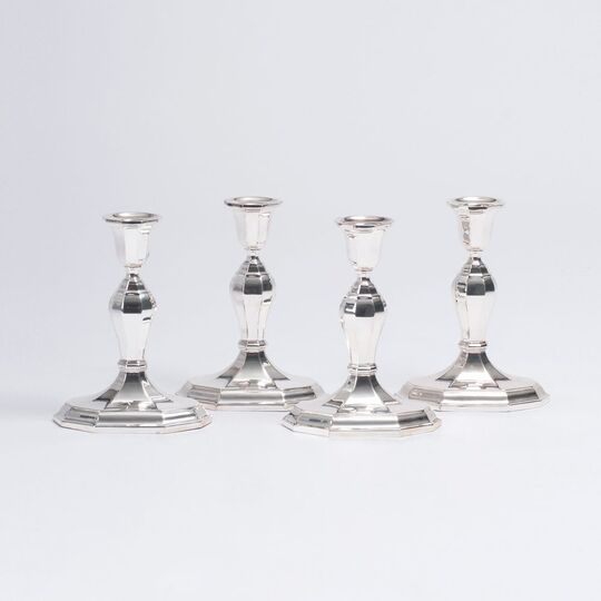 A Set of 4 Classical Candle Holders