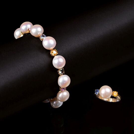 A Pearl Bracelet and Ring with coloured Sapphires