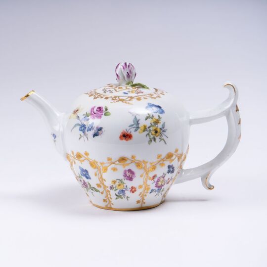 A Teapot with Flower and Trellis Decoration