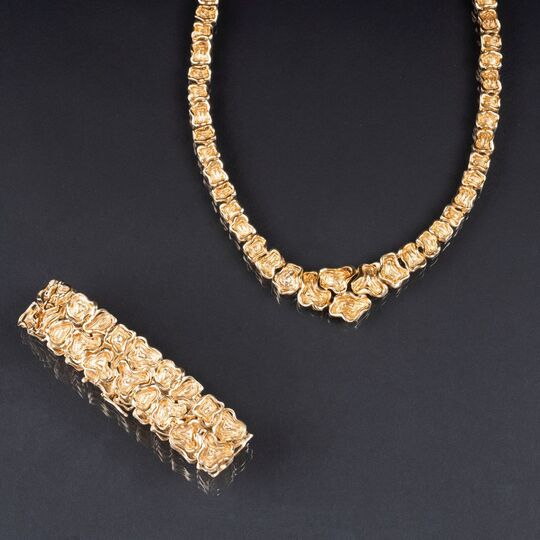 A Gold Necklace with matching Bracelet