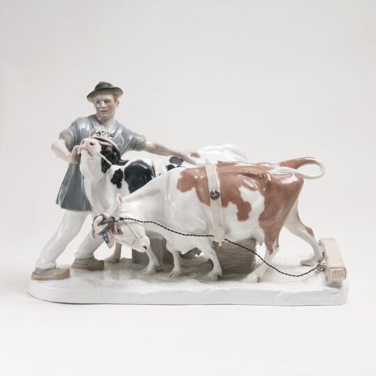 A Figure Group 'Farmer with Yoke of Oxen'