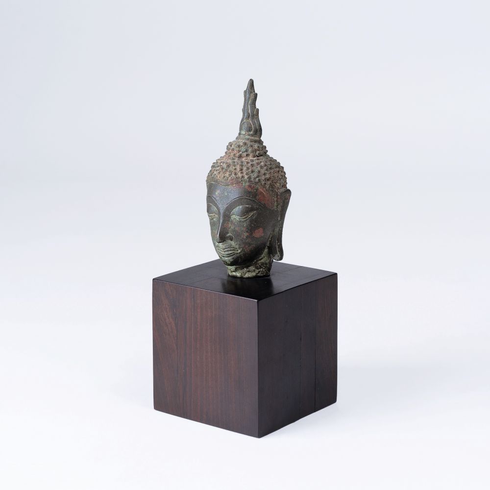 A Small Bronze Head of Buddha A Small Bronze Head of Buddha