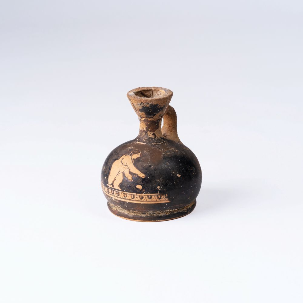 An Attic Miniature Red-Figure Squat Lekythos An Attic Miniature Red-Figure Squat Lekythos