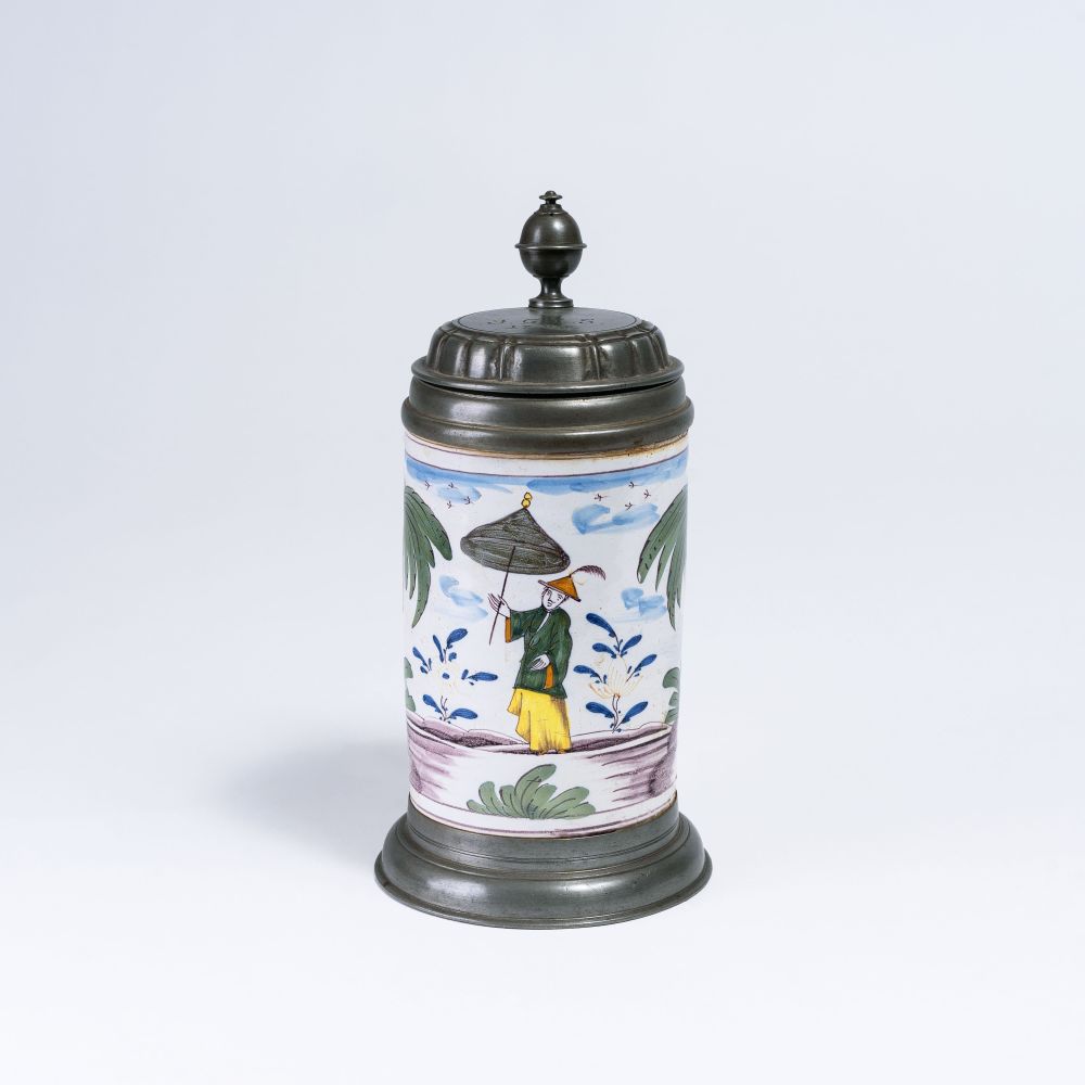 A Faience Tankard with a Chinese A Faience Tankard with a Chinese