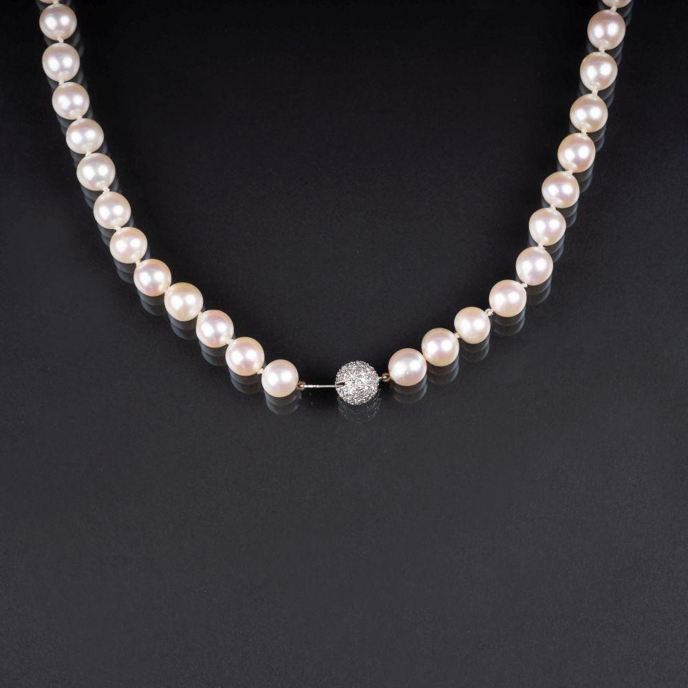 A long Pearl Necklace with Diamond Clasp