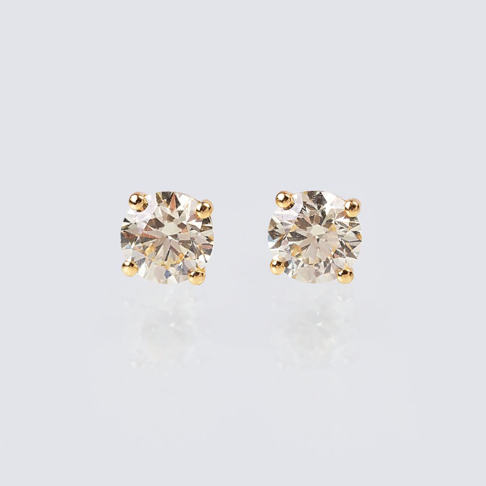A Pair of Solitaire Diamond Earstuds with Fancy Diamonds A Pair of Solitaire Diamond Earstuds with Fancy Diamonds