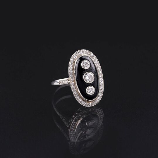 An Art-déco Diamond Onyx Ring
