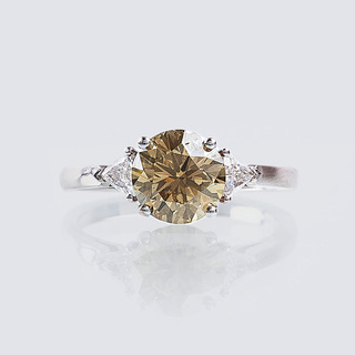 A Fancy Solitaire Diamond Ring with Triangle Diamonds