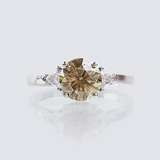 - A Fancy Solitaire Diamond Ring with Triangle Diamonds A Fancy Solitaire Diamond Ring with Triangle Diamonds