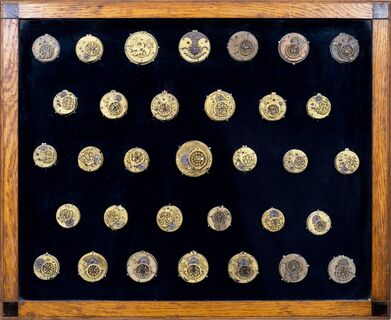 Three Glass Cabinets with antique Watch Movements and Watch Parts by English and French Masters