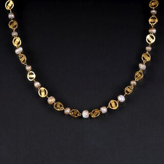 A Gold Necklace with small Pearls