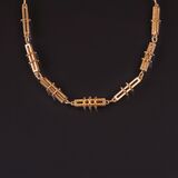 A long Gold Necklace