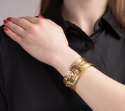 A Gold Bangle Bracelet with Precious Stones 'Elephants' - image 2