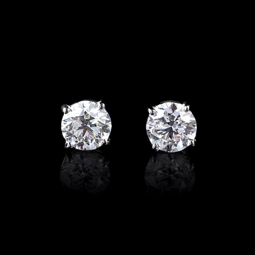 A Pair of Rare White Solitaire Diamond Earstuds