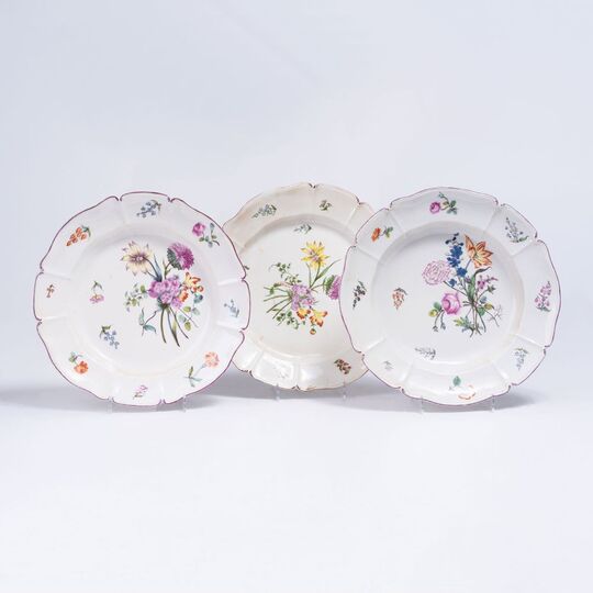A Set of Three Plates with Fine Floral Bouquets
