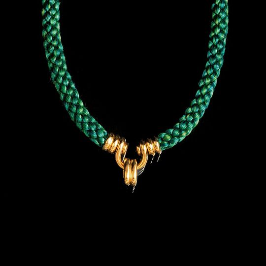 A Braid Necklace with Gold Centerpiece