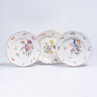 A Set of Three Plates with Fine Floral Bouquets