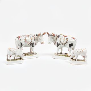 A Set of 4 Faience Cows