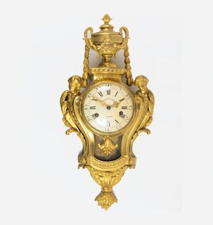 A large Louis XVI Cartel Clock with Female Hermen and Vase