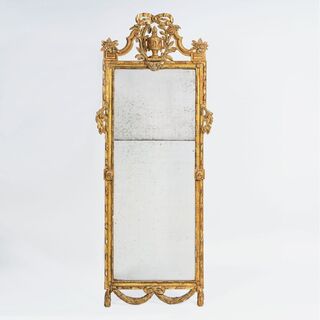 A Large Louis XVI Mirror with Vase-Culmination
