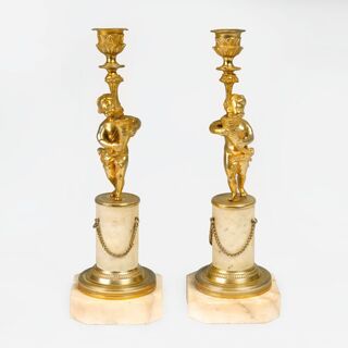 A Pair of Napoleon III Candlesticks with Putti