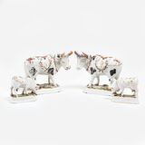 A Set of 4 Faience Cows