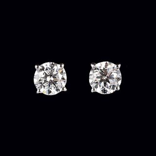 A Pair of rare-white Solitaire Diamond Earstuds