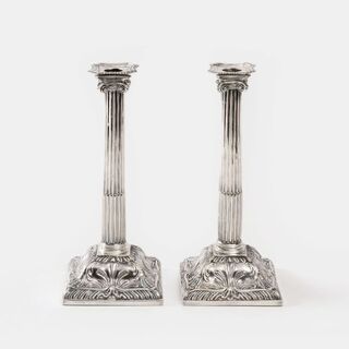 A Pair of George III Candlesticks