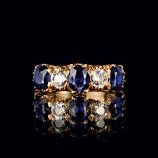 A Natural Sapphire Ring with Old Cut Diamonds
