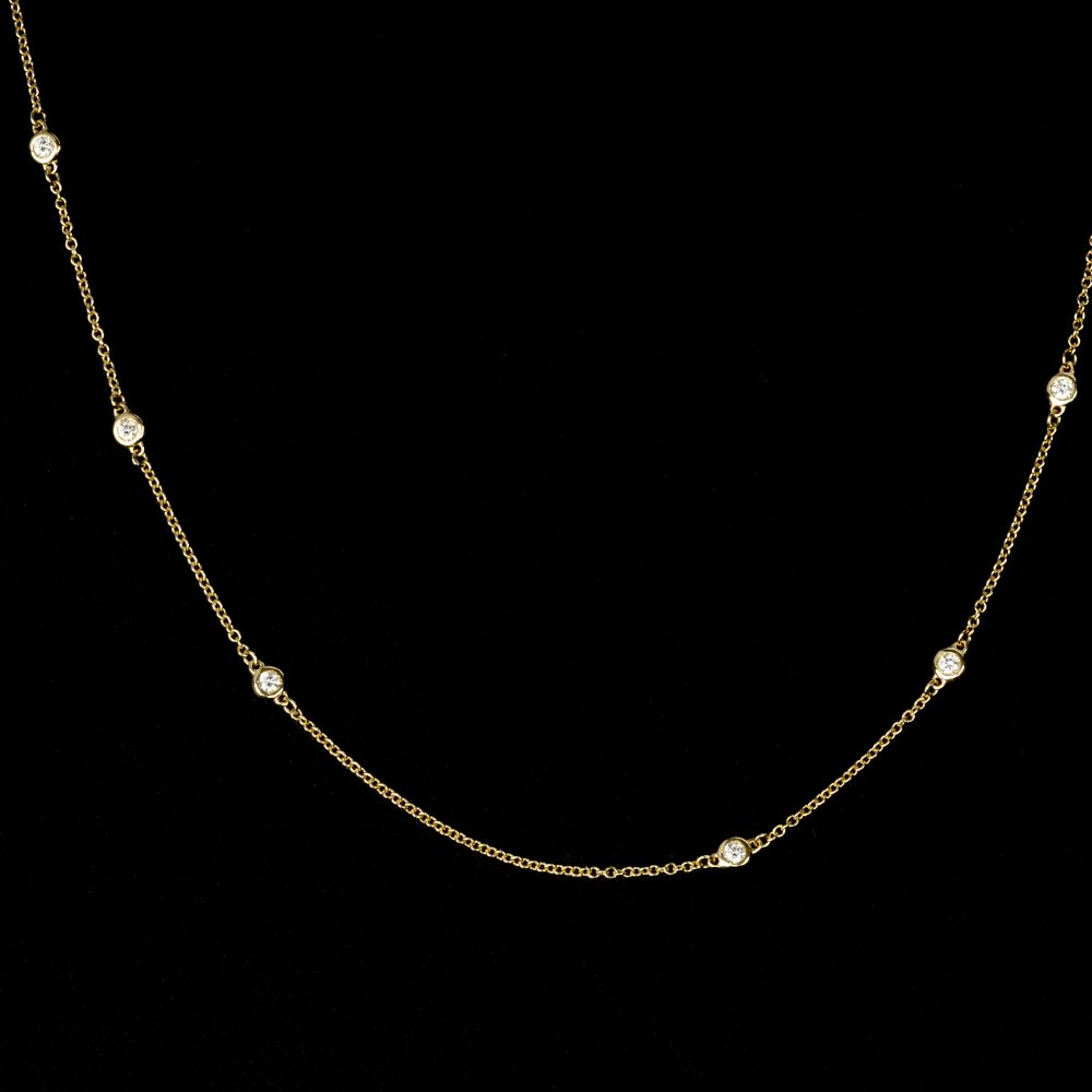 A petite Gold Necklace with Diamonds