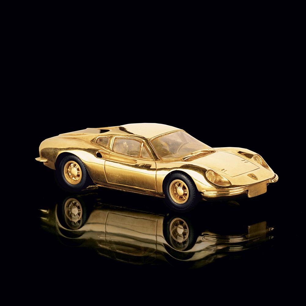 A Gold Model Car 'Ferrar Dino'