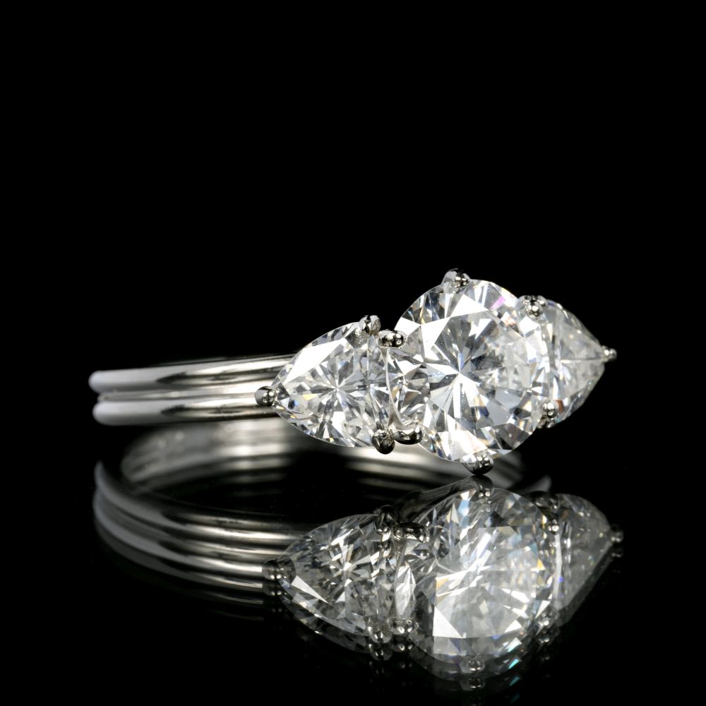A Exceptional White Solitaire Diamond Ring with Triangle Diamonds - image 2