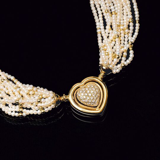 A Pearl Necklace with Diamond Heart Shaped Clasp