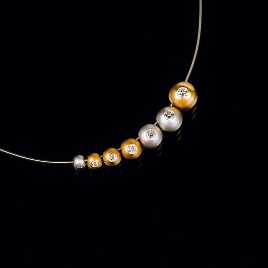 A Necklace with 7 Diamond Spheres in Platinum and Gold