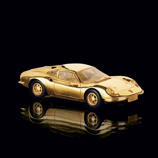 A Gold Model Car 'Ferrar Dino'