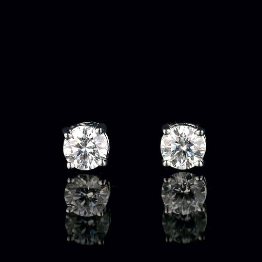 A Pair of rare-white Solitaire Diamond Earstuds