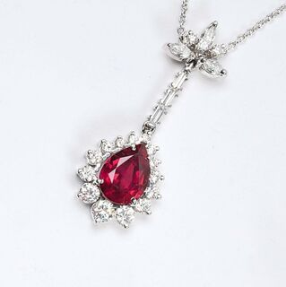 A natural Ruby Pendant with Diamonds on Necklace