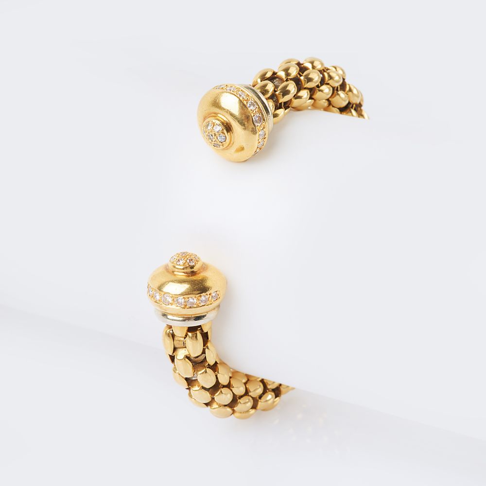 A Gold Bangle Bracelet with Diamonds A Gold Bangle Bracelet with Diamonds