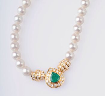 A Pearl Necklace with Emerald and Diamonds
