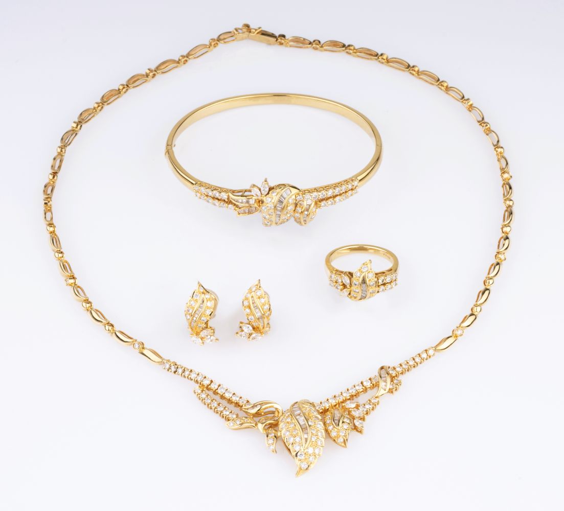 A Diamond Parure with Necklace, Bangle Bracelet, Ring and Pair of Earclips A Diamond Parure with Necklace, Bangle Bracelet, Ring and Pair of Earclips