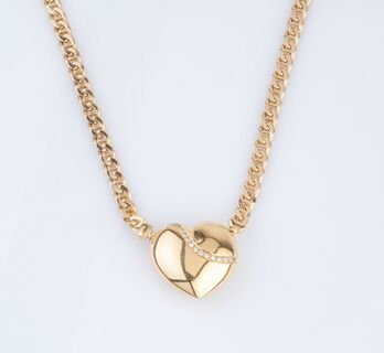 A Gold Necklace with heartshaped Diamond Clasp