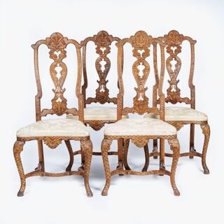 A Set of 4 Rococo Chairs with rare Scale Carving