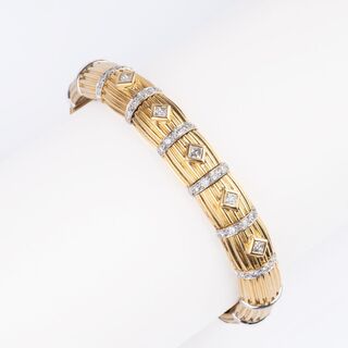 A Gold Bangle Bracelet with Diamonds