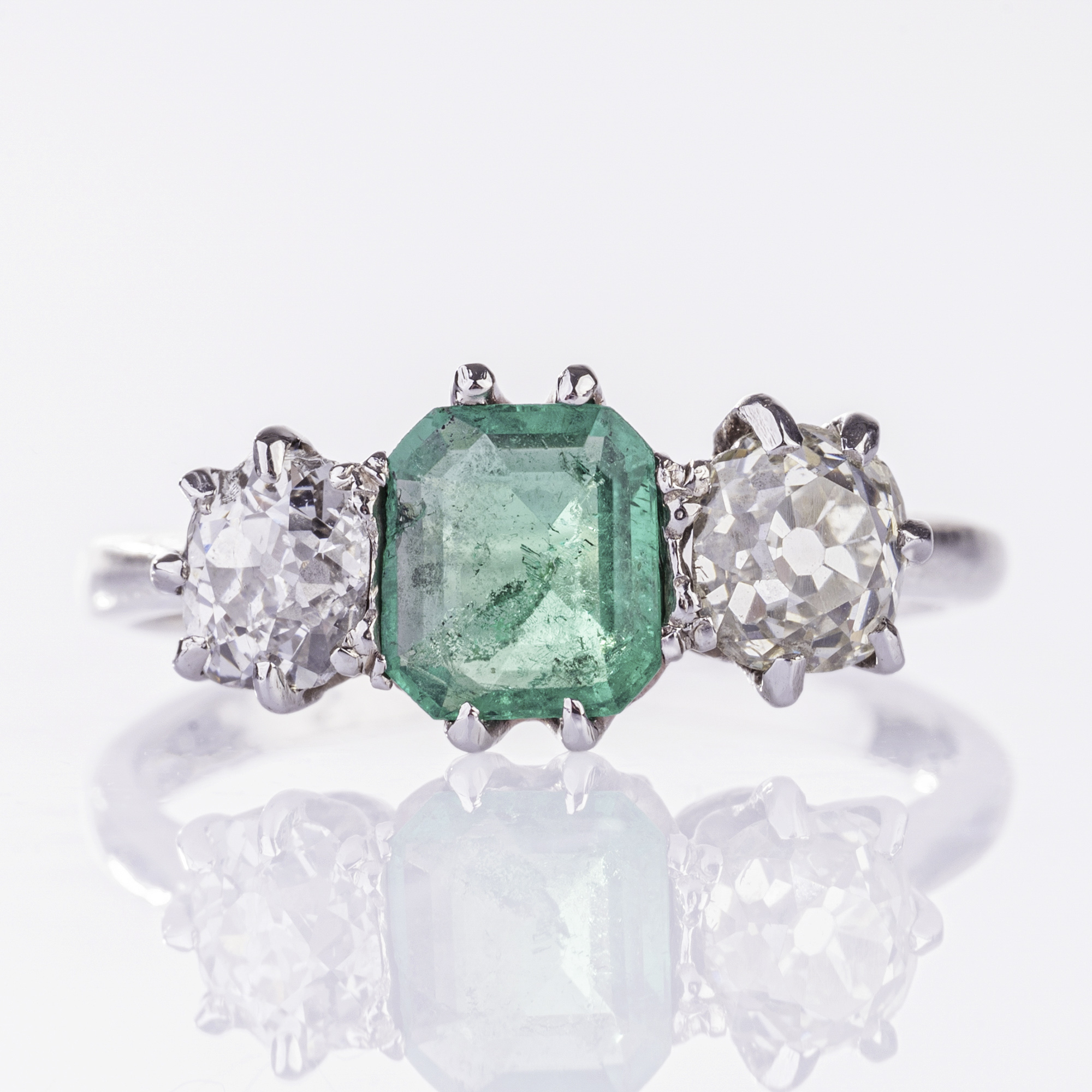 An Emerald Ring with Old Cut Diamonds An Emerald Ring with Old Cut Diamonds