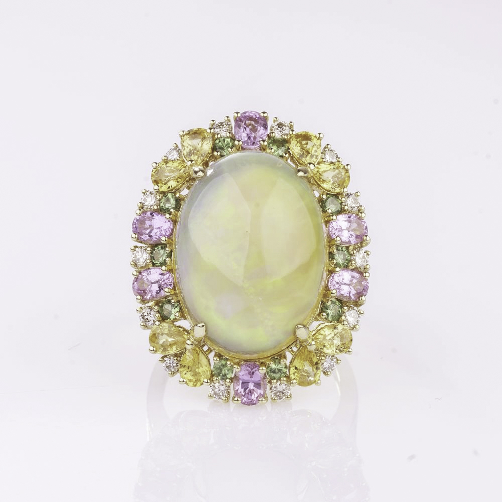 A large Opal Ring with colourful Sapphires and Diamonds A large Opal Ring with colourful Sapphires and Diamonds