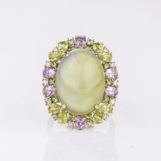 A large Opal Ring with colourful Sapphires and Diamonds