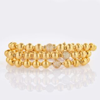 Three Gold Bracelets with Diamonds