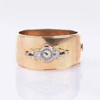 Art-déco Diamond Watch on a Gold Bangle Bracelet
