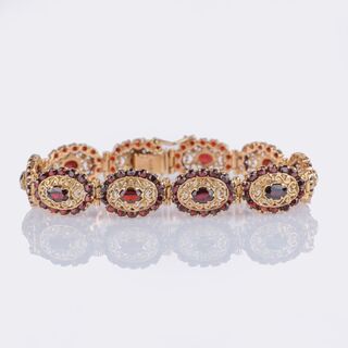 Gold Bracelet with Garnets